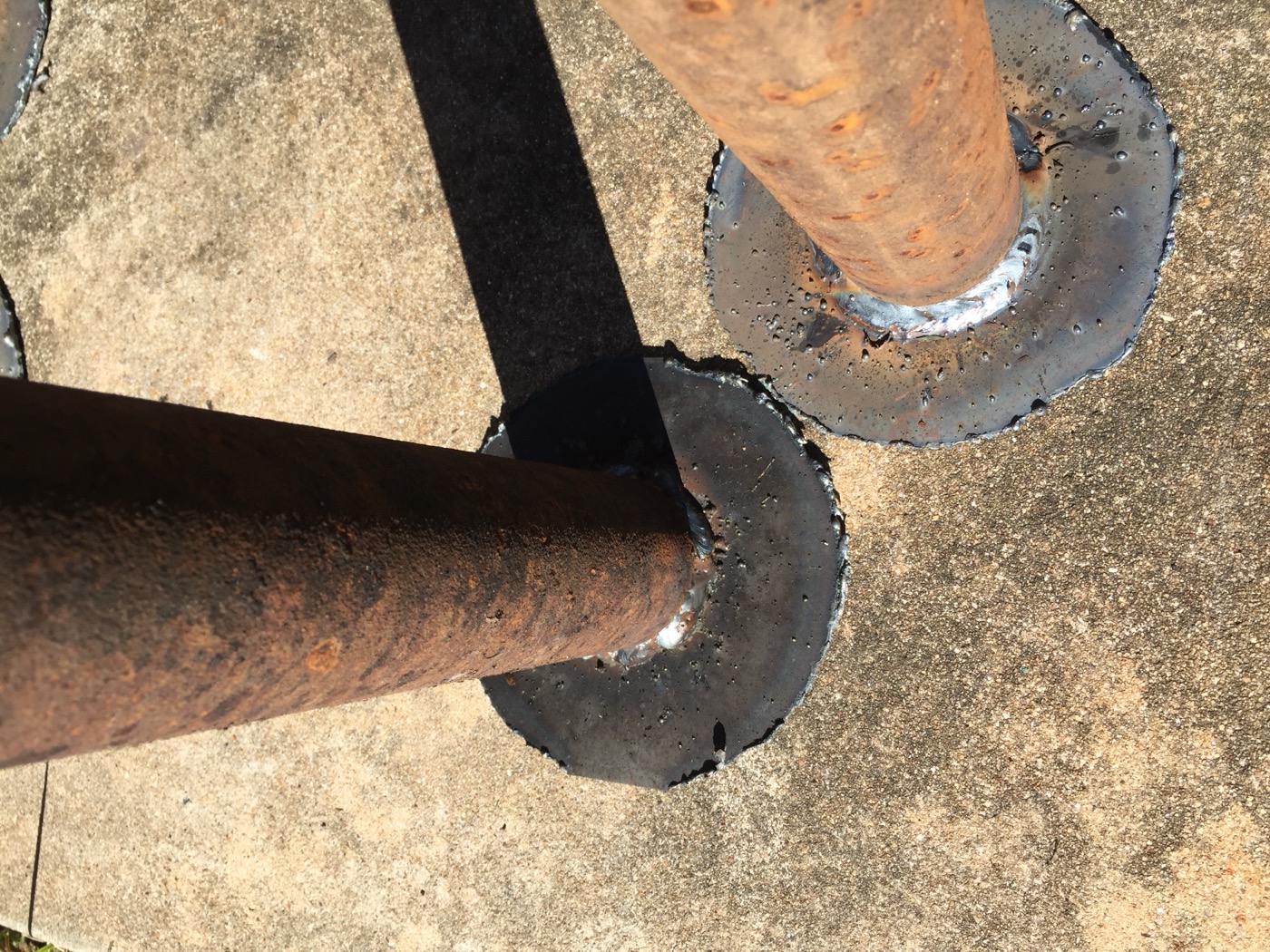 Pipe base welds, concrete